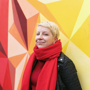 Sylwia with red and yellow mural