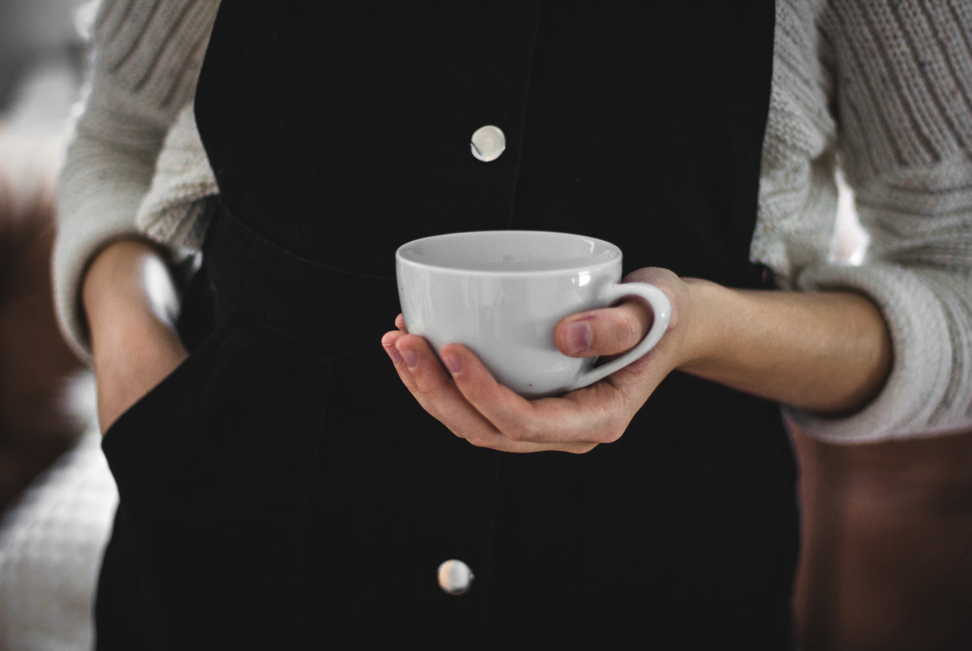 woman holding coffee cup