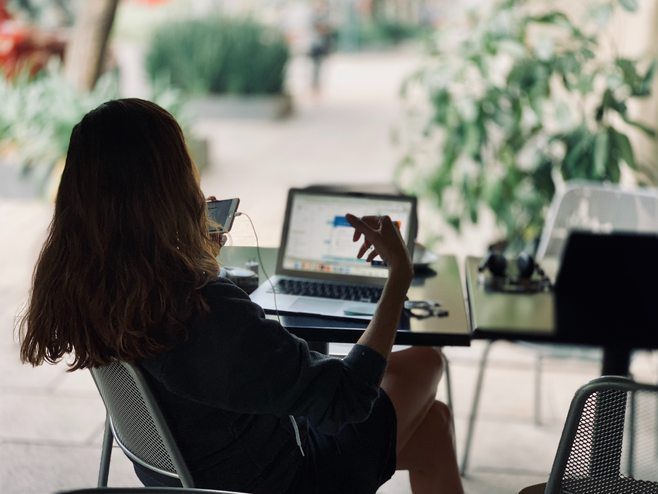 Woman in iPhone with laptop